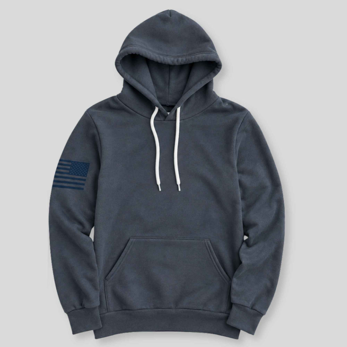 A dark slate gray pullover hoodie with white drawstrings and a navy blue distressed American flag graphic on the left sleeve, displayed against a solid light gray background.