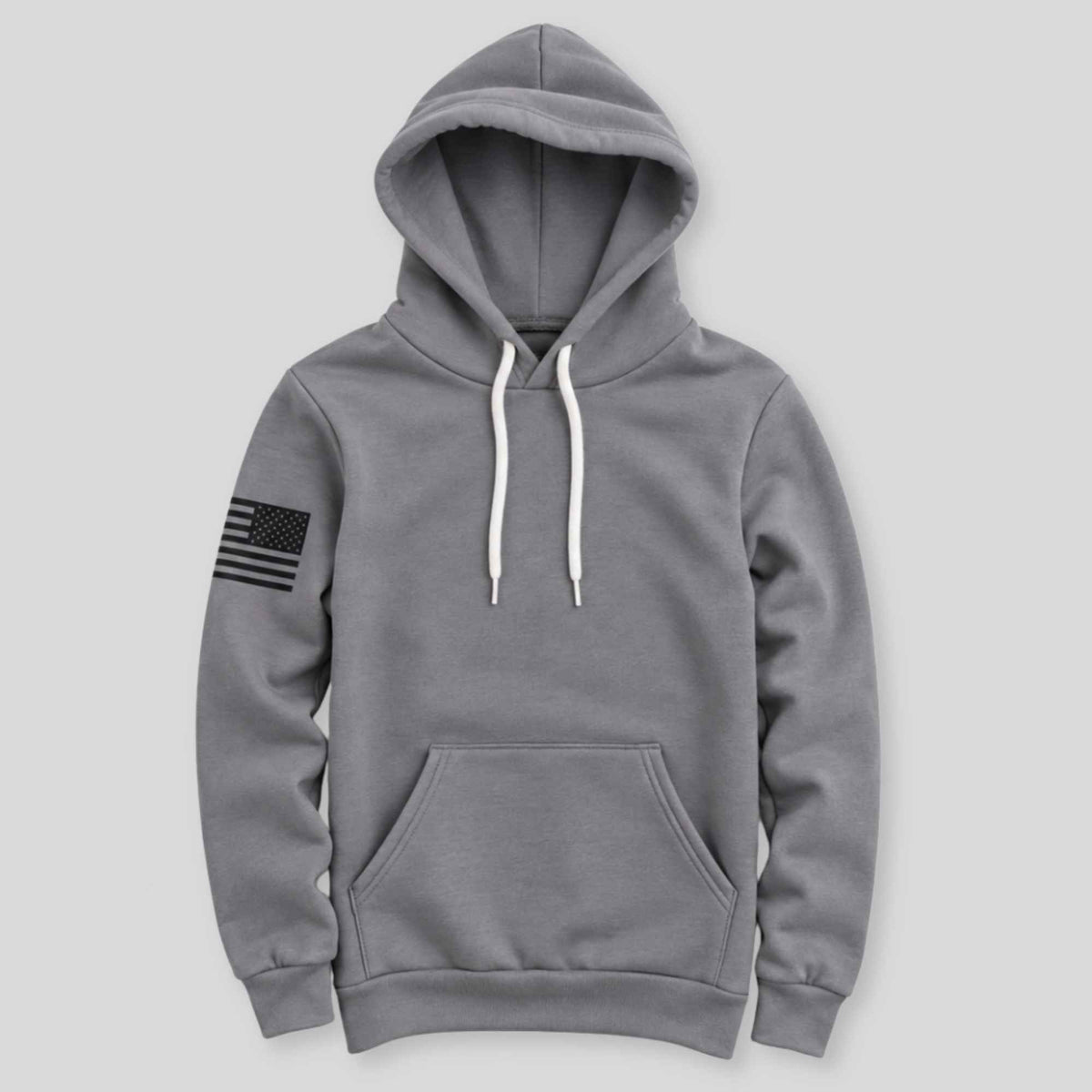 A gray pullover hoodie with white drawstrings and a black distressed American flag patch on the left sleeve, displayed against a light gray background.